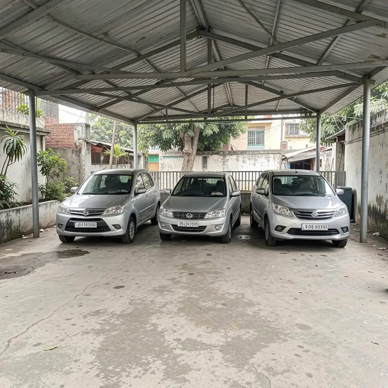 Car parking shed sheltering three silver cars in a residential yard