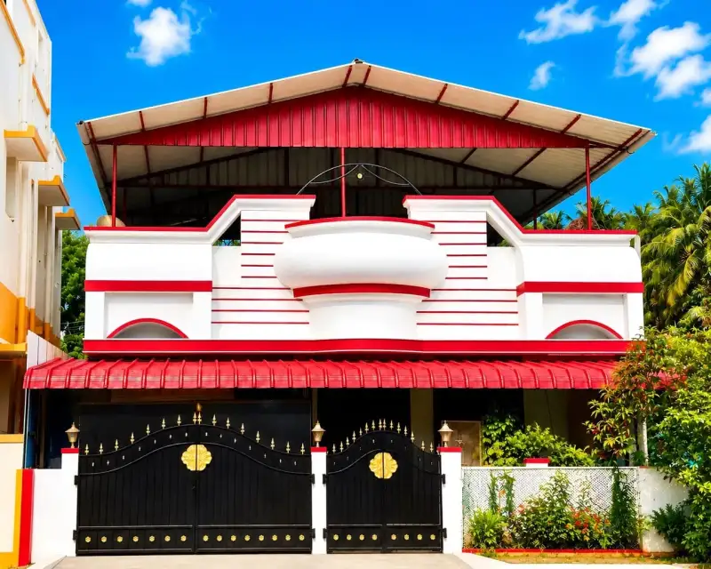Red-and-white terrace roofing shed on a decorative home facade